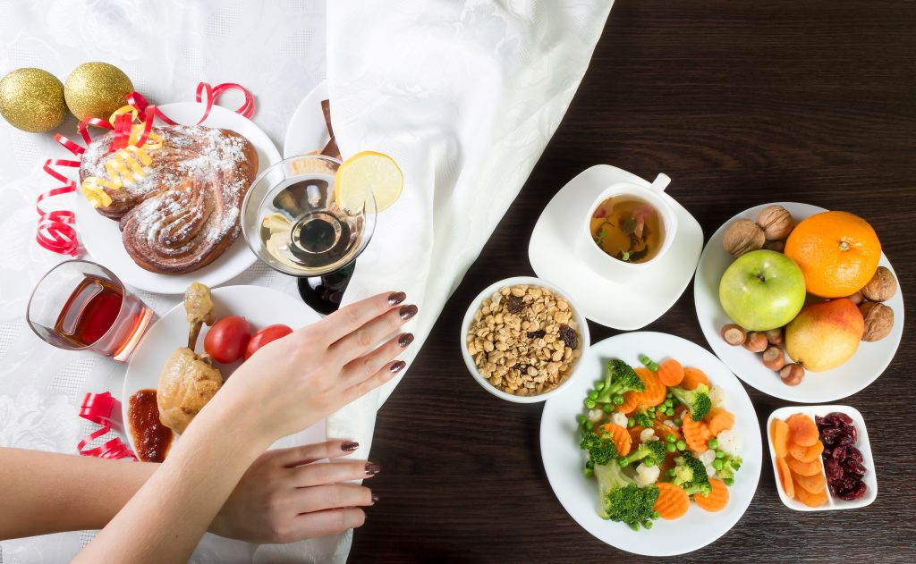 Table with healthy and unhealthy food and alcohol.