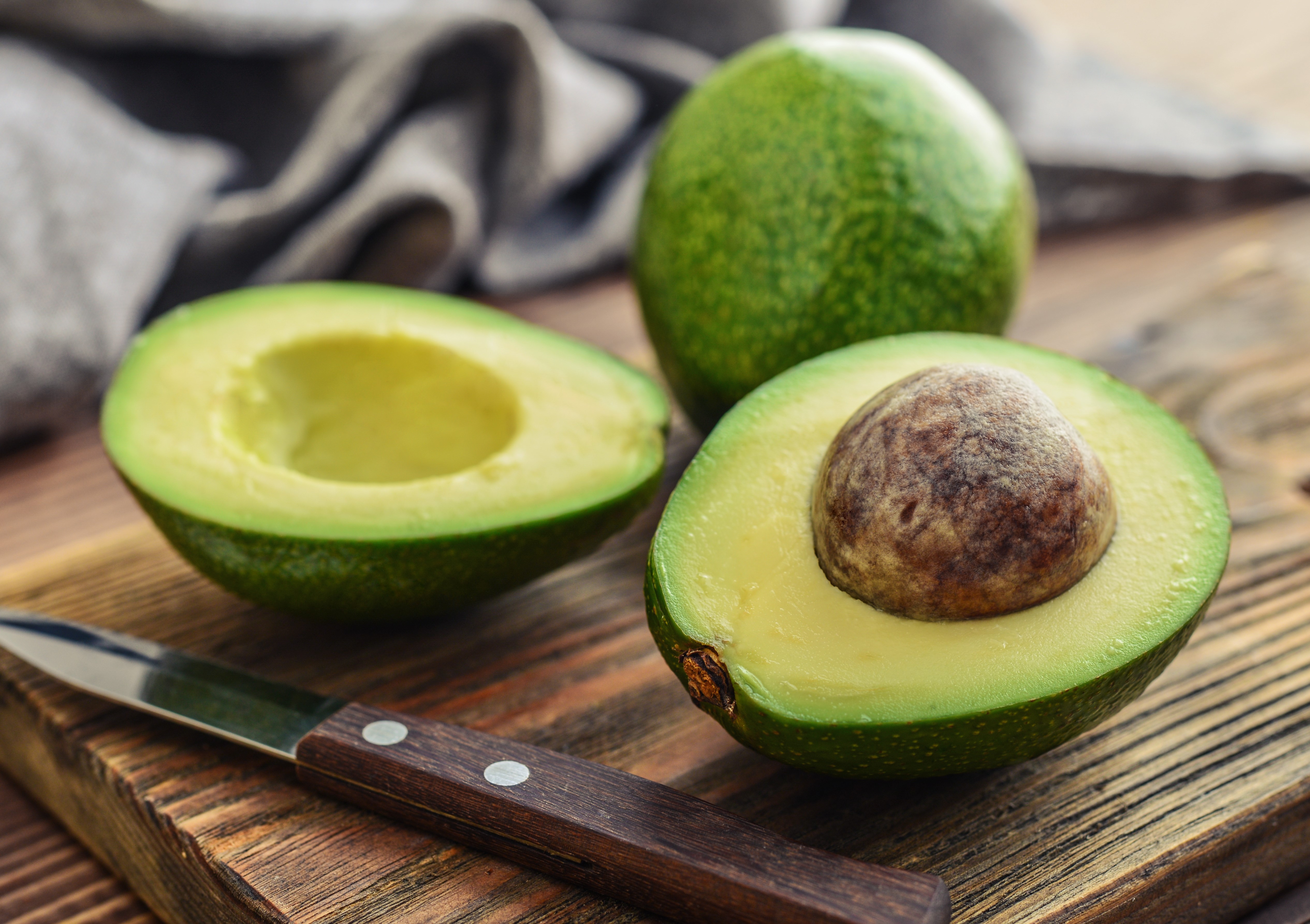 Fresh avocado on cutting board