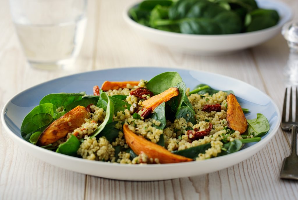 Healthy quinoa salad with roasted sweet potatoes wedges